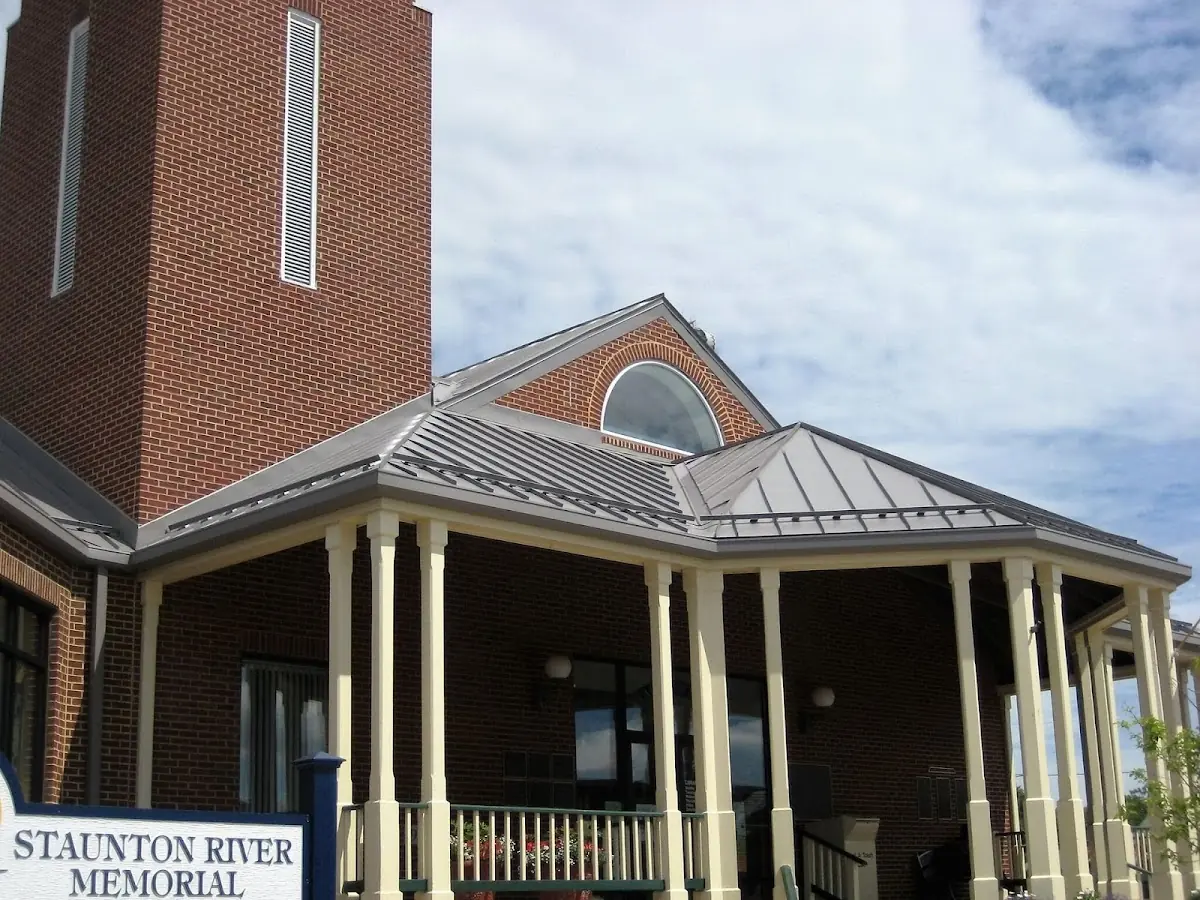Skilled roofing craftsmen working on a residential roof in College